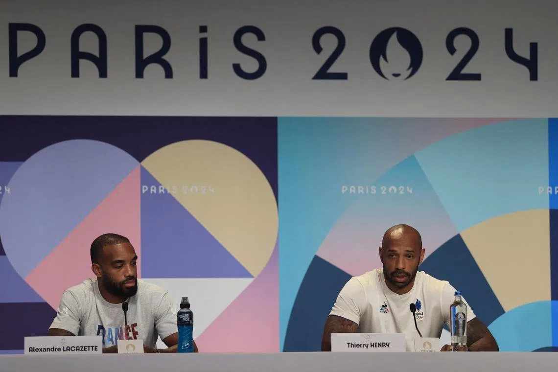 France captain Alexandre Lacazette and coach Thierry Henry at a Paris Olympics press conference on Aug 8, 2024 ahead of the men's football final against Spain.
