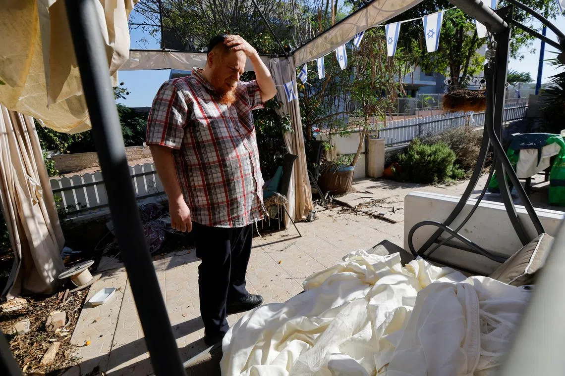 FILE PHOTO: Dori Galili, 49, prepares his house for the return of his wife and six children, after they evacuated following the October 7 attack by Palestinian Islamist group Hamas, in Sderot, Israel November 29, 2023. REUTERS/Alexander Ermochenko/File photo