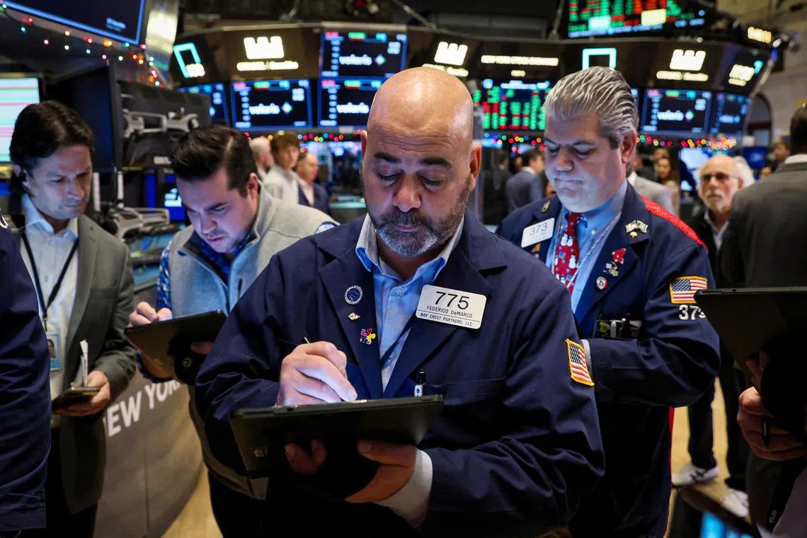 Traders work on the floor of the New York Stock Exchange.