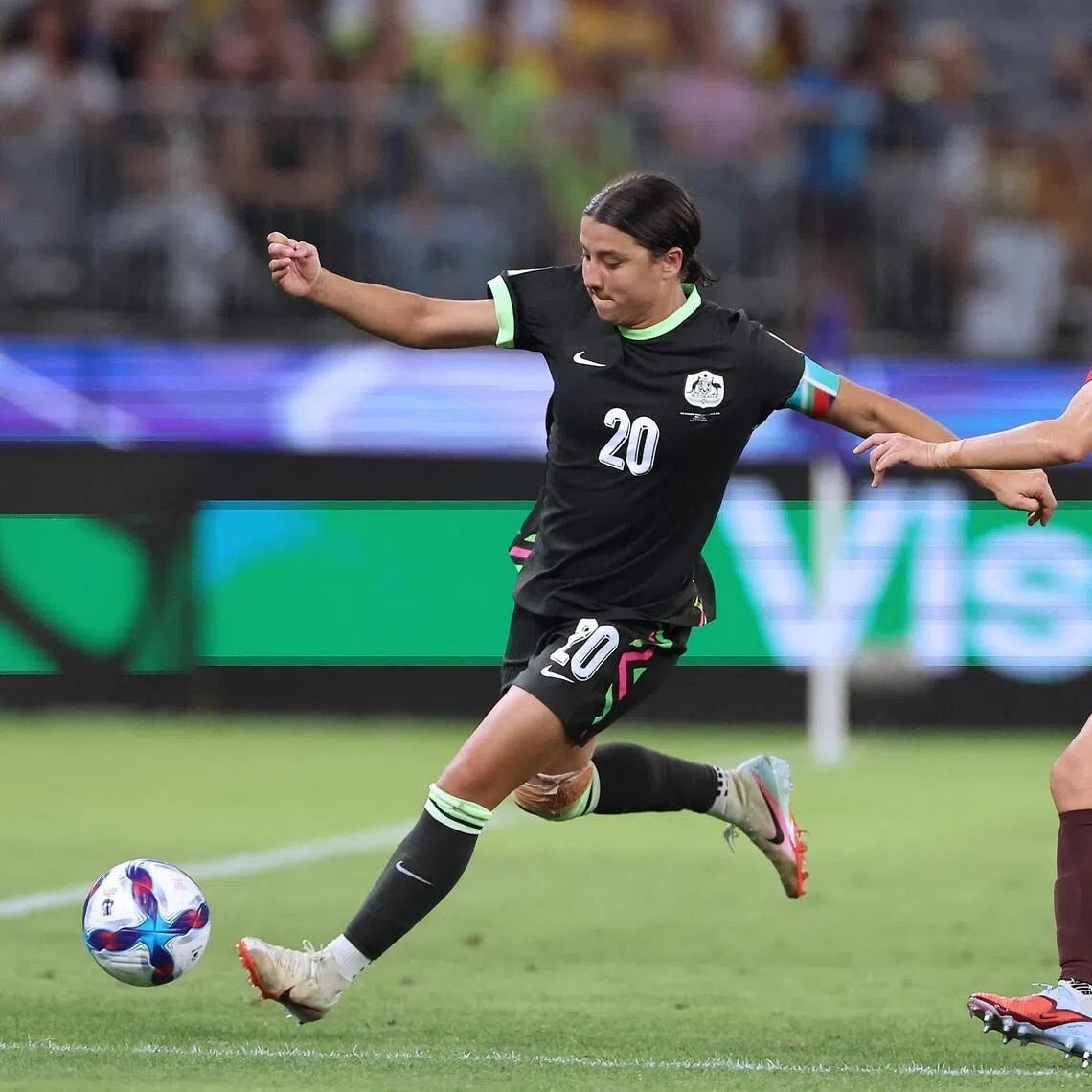 Australia's Sam Kerr (left) and China's Yao Wei fighting for the ball during the Women’s Asian Cup semi-final in Perth on March 17.