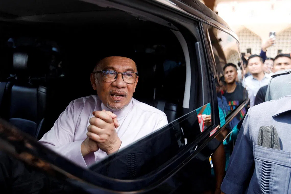FILE PHOTO: Newly elected Malaysia's Prime Minister Anwar Ibrahim meets supporters during his first public appearance as he attending Friday prayer at a mosque in Putrajaya, Malaysia November 25, 2022. REUTERS/Hasnoor Hussain/File Photo