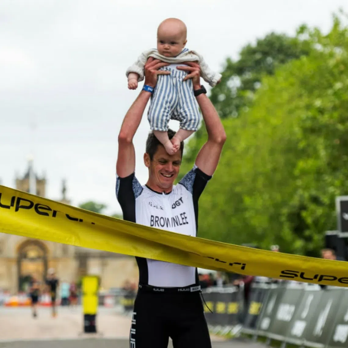 Jonny Brownlee with his seven-month-old son Freddie at the Supertri Blenheim Palace event in June.