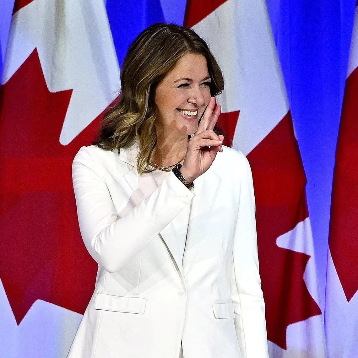 FILE PHOTO: Alberta’s Premier Danielle Smith gestures on the final day of the national convention for Canada's official opposition Conservative Party, in the wake of its April 2025 election loss, the day after party members voted 87.4 per cent in favour of keeping leader Pierre Poilievre, in Calgary, Alberta, Canada January 31, 2026. REUTERS/Jennifer Gauthier/File Photo