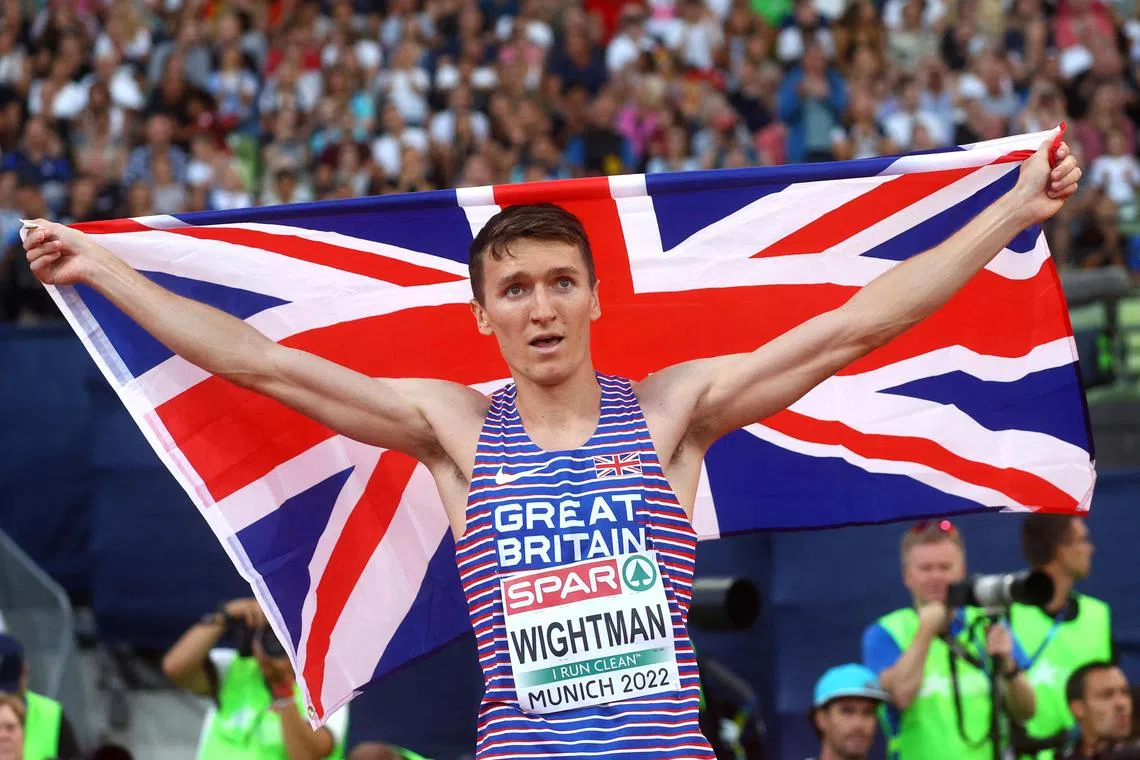 Britain's Jake Wightman celebrating after winning silver in the men's 800m final at the European Championships in Germany in 2022. He will not defend his 1,500m title at August's world championships due to a foot injury.