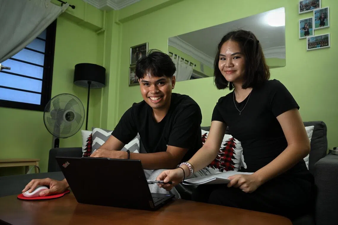 Troy Lee MS De Silva, 20, and his sister Zara Umeria Mohd Shaffari, 16 who started taking on caregiving duties as children in their teens when their dad fell ill, studying at home on Jan 9, 2026.