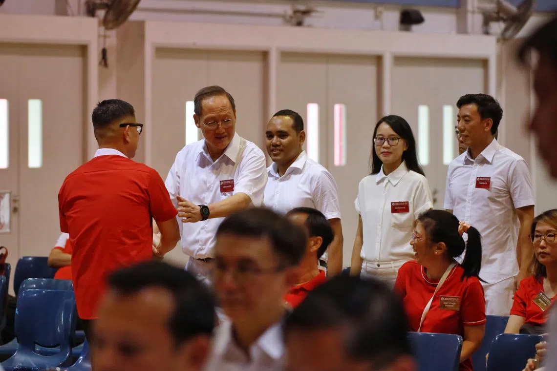 PAP CCK GRC candidates Tan See Leng, Zhulkarnain Abdul Rahim, Choo Pei Ling, Jeffrey Siow meeting PSP candidate Lawrence Pek in the hall at Jurong-Pioneer Junior College nomination centre on April 23.