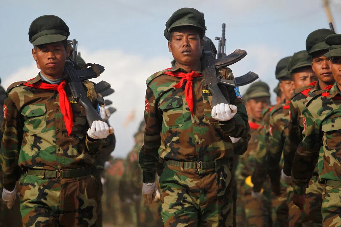 FILE PHOTO: Taang National Liberation Army (TNLA) soliders march during the 51st anniversary of Taang National Resistance Day at Homain, Nansan township in the northern Shan state, January 12, 2014. REUTERS/Soe Zeya Tun/File Photo