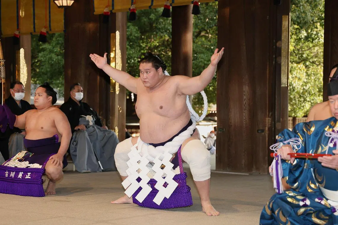 Mongolian-born "yokozuna", or grand champion, Terunofuji taking part in a traditional ring-entering ceremony at Meiji Shrine in Tokyo. 