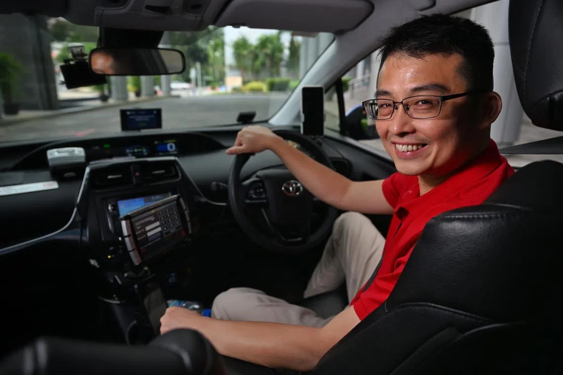 Vlogger and taxi driver Edward Jui (LazyCabbie) in his taxi.