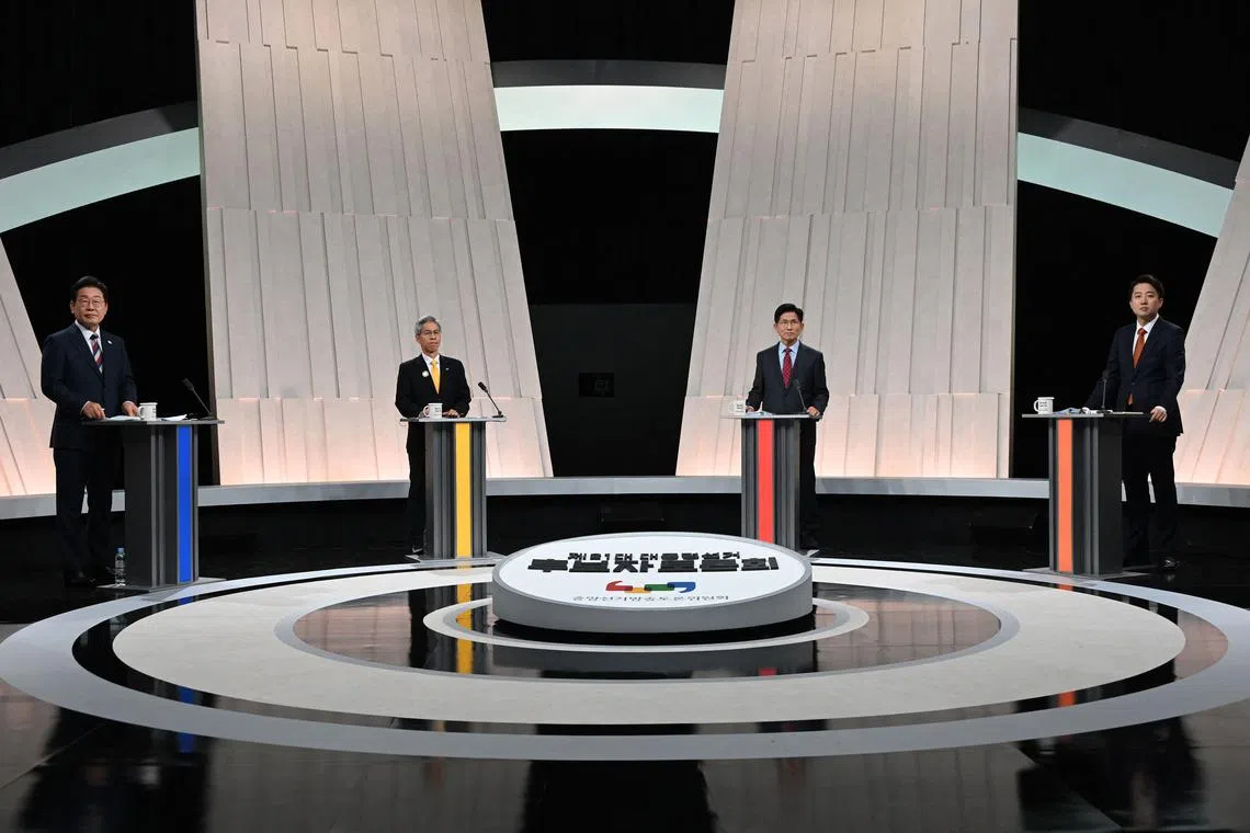 South Korea's presidential candidates, Mr Lee Jae-myung, Mr Kwon Young-guk, Mr Kim Moon-soo and Mr Lee Jun-seok stand at their respective podiums for the third televised presidential debate.
