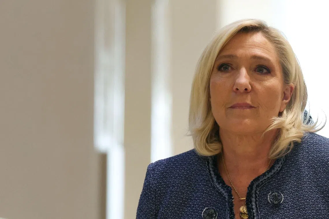 Le Pen, her party National Rally and two dozen party figures were accused of diverting European Parliament funds to pay France-based party staff. 