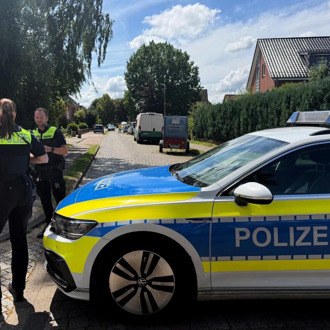 Police secure a youth welfare facility in the northern German town of Stade where at least five people were gunned down.