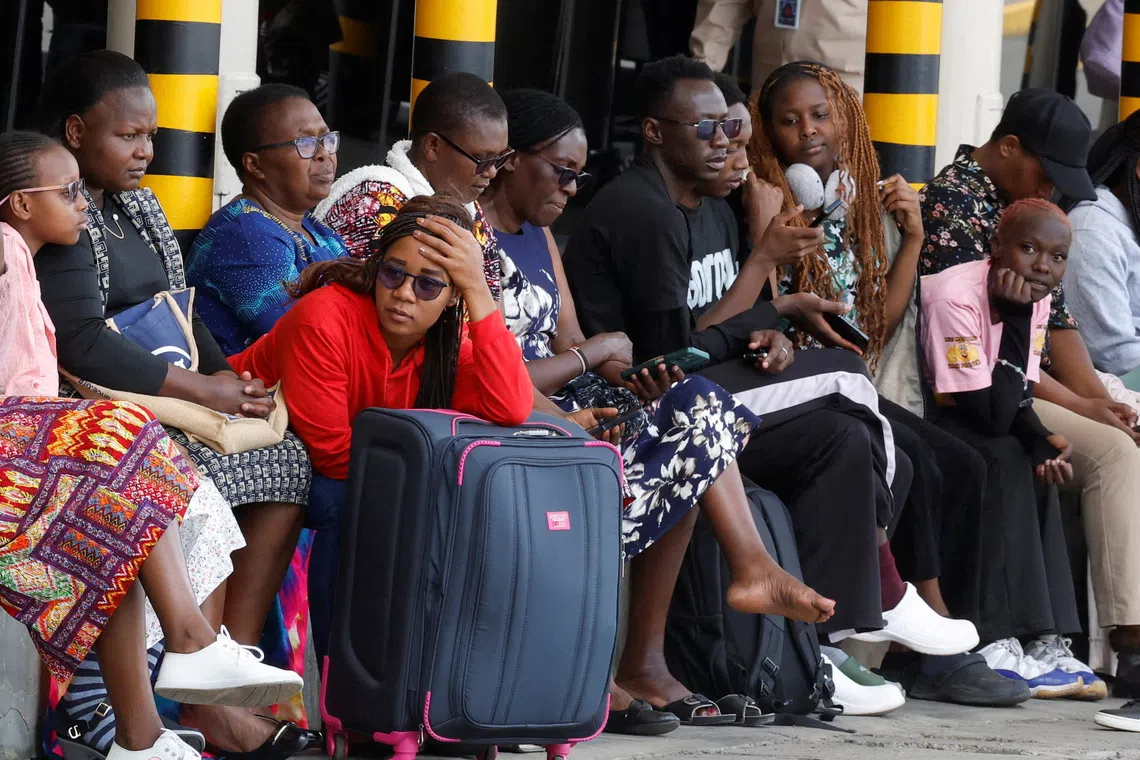 Stranded travellers wait with their luggage after their flight operations were disrupted due to a strike by workers at the Jomo Kenyatta International Airport (JKIA) in Nairobi, Kenya, August 30, 2026. REUTERS/Monicah Mwangi