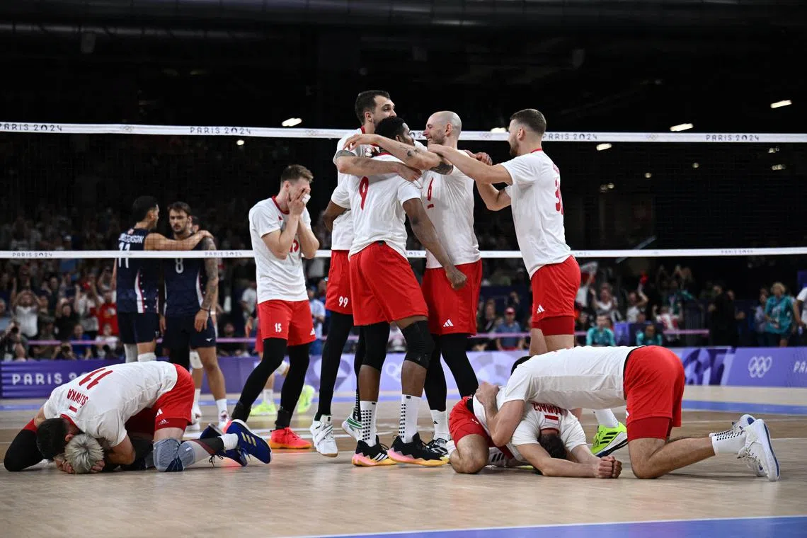 Poland volleyball players celebrate after they beat the US in the Olympics semi-finals on Aug 7, 2024.