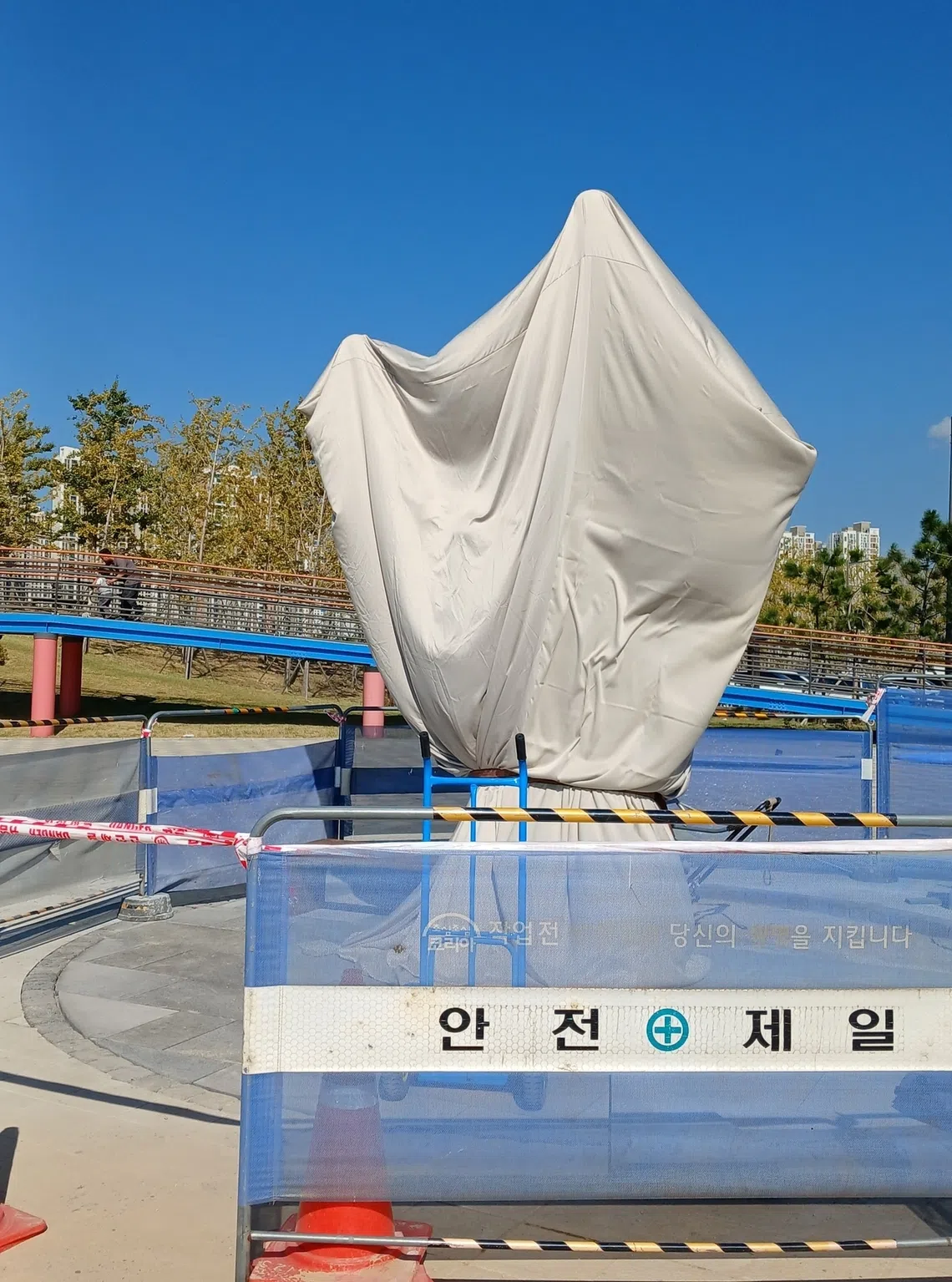 As complaints mounted, authorities covered the sculpture with a tarp and began work on improvements.