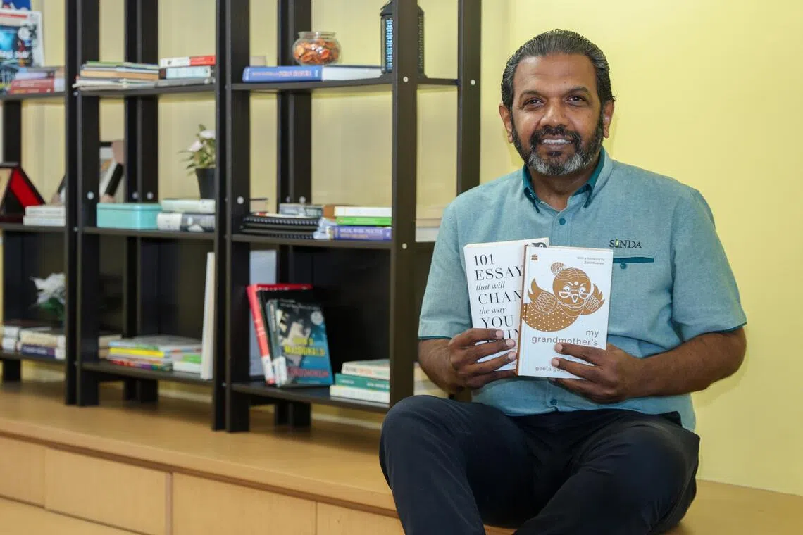 ST20260624_202670000268/Sarah Lee/shtalk
Singapore Indian Development Association (SINDA) chief executive officer Anbarasu Rajendran, 54, photographed at the SINDA Headquarters with his books.