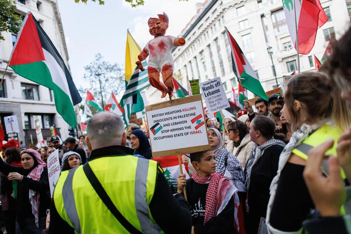 Pro-Palestinian demonstrators marching in London on Oct 5, to demand an end to the bloodshed in Gaza.