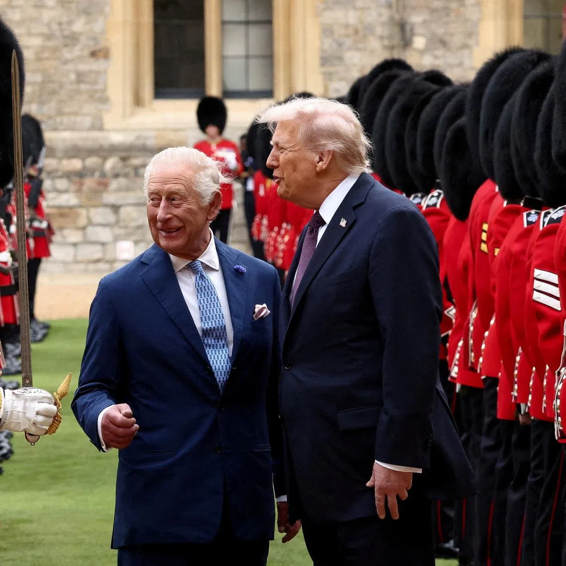 US President Donald Trump and Britain's King Charles inspect the Guard of Honour as they attend a welcome ceremony during Trump's state visit, at Windsor Castle, in Windsor, Britain, September 17, 2025.