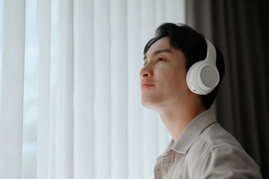 Man listening to music on noise-cancelling headphones