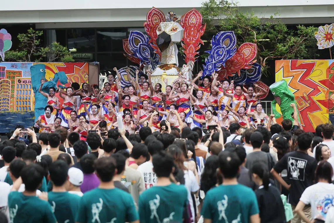 Students from the College of Design and Engineering performing during Rag and Flag Day at NUS on Aug 10.
