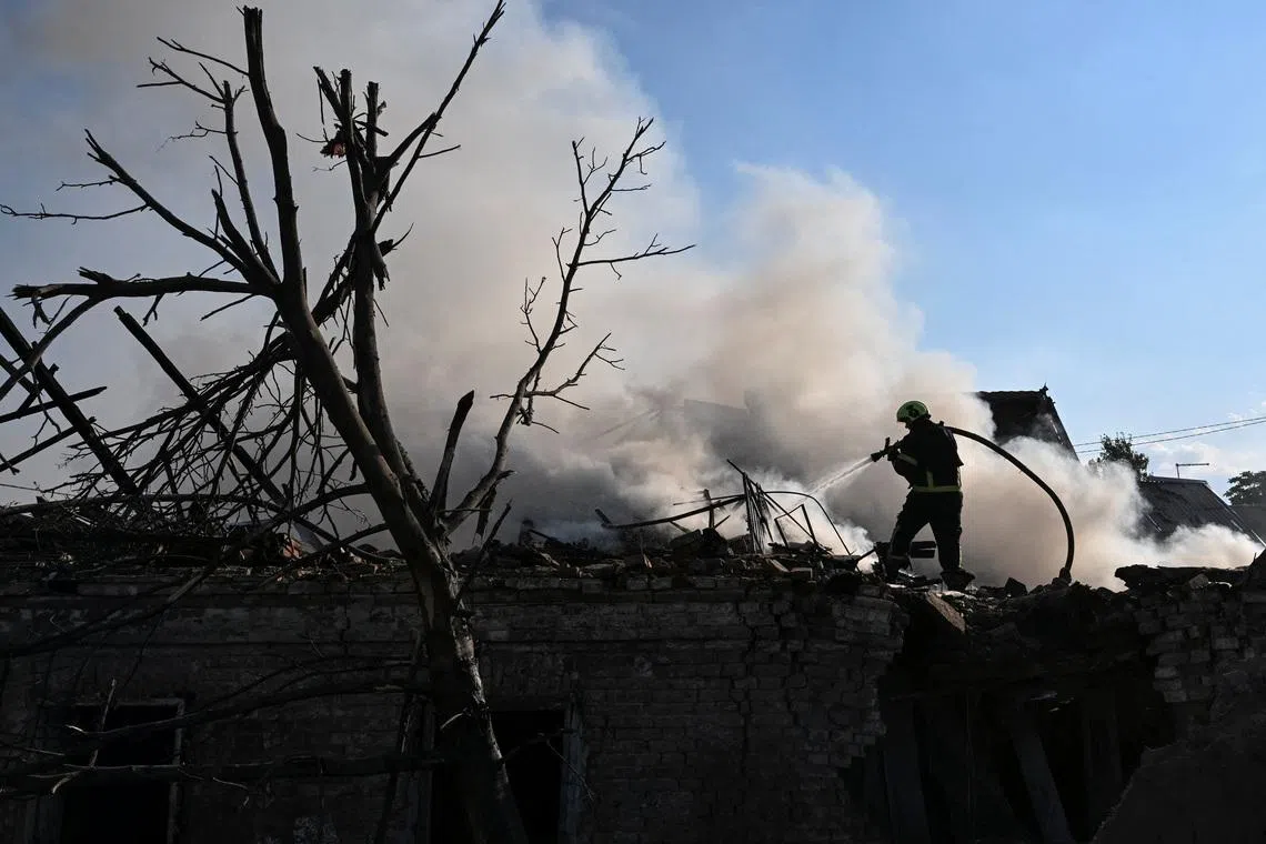 A firefighter works at the site of a Russian air strike, amid Russia's attack on Ukraine, in Zaporizhzhia, Ukraine June 30, 2026. REUTERS/Stringer