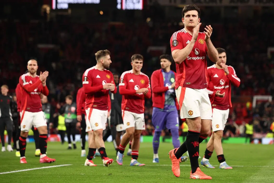 Manchester United's Harry Maguire celebrating their 7-6 aggregate victory over Olympique Lyonnais.