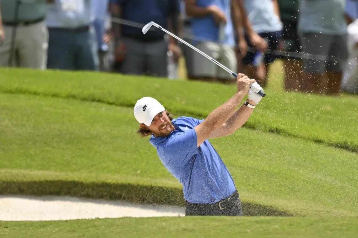 Tommy Fleetwood plays a shot from a bunker on the 18th hole during the second round of the St. Jude Championship.