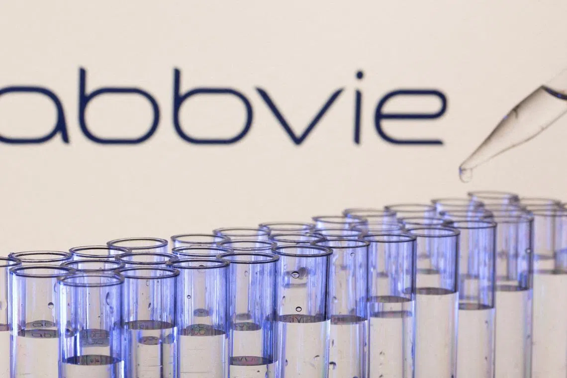 FILE PHOTO: Test tubes are seen in front of a displayed Abbvie logo in this illustration taken, May 21, 2021. REUTERS/Dado Ruvic/Illustration/File Photo