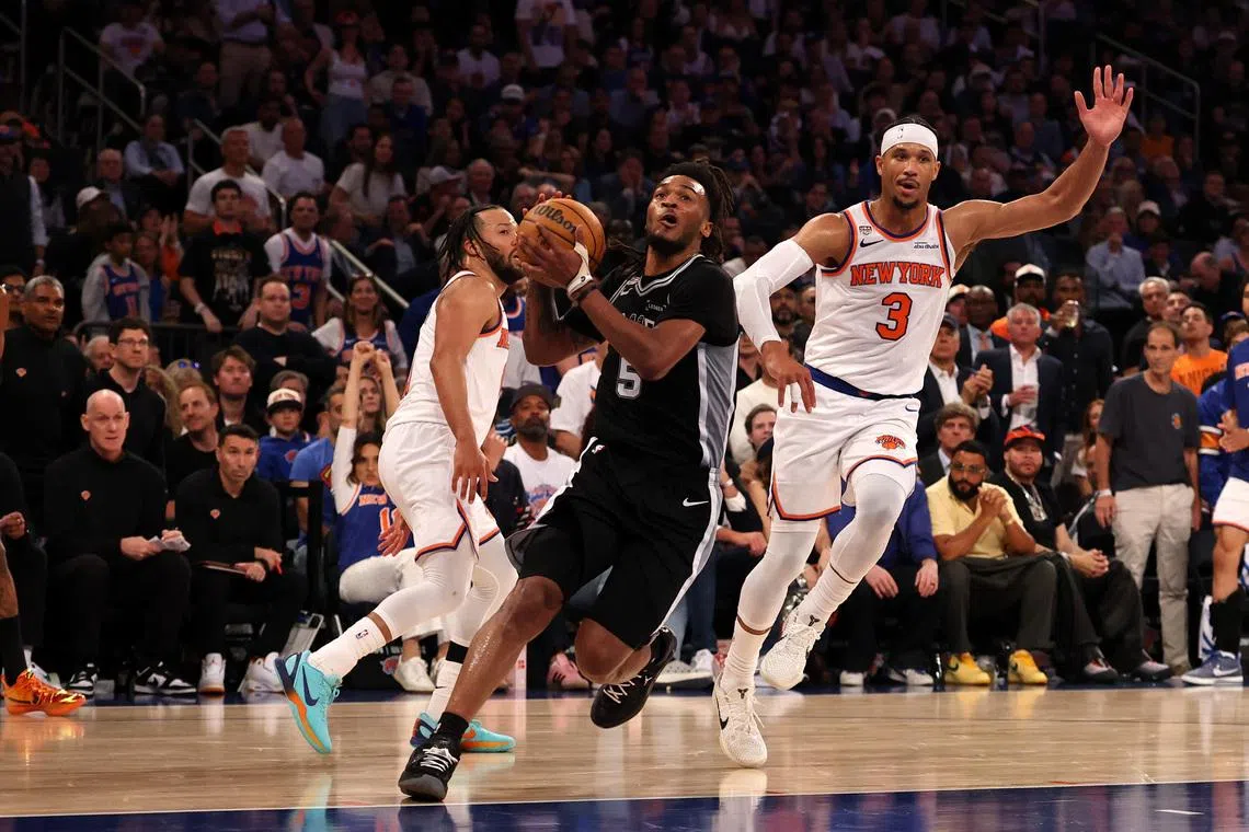 Jun 8, 2026; New York, New York, USA; San Antonio Spurs guard Stephon Castle (5) drives to the basket against New York Knicks guard Josh Hart (3) during game three of the 2026 NBA Finals in the third quarter at Madison Square Garden. Mandatory Credit: Geoff Burke-Imagn Images