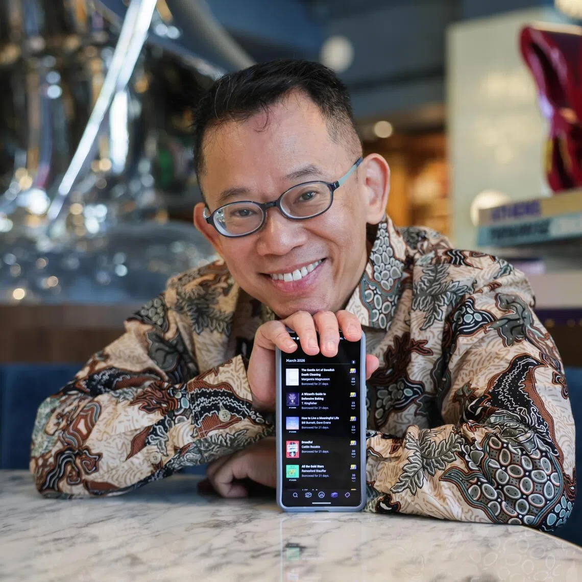 Mr Jason Leow shows his library on the Libby app, where he accesses most of his audiobooks and e-books.