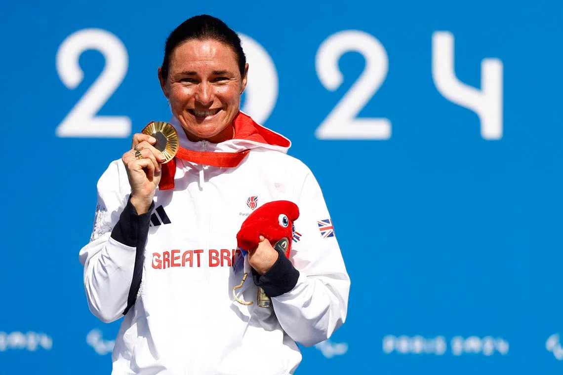 Paris 2024 Paralympics - Road Cycling - Women's C4-5 Road Race - Victory Ceremony - Clichy-sous-Bois, France - September 6, 2024 Sarah Storey of Britain celebrates on the podium after winning the gold medal. REUTERS/Maria Abranches