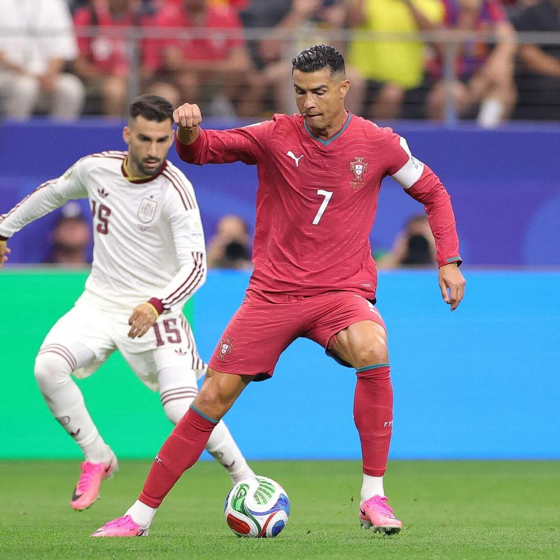 Cristiano Ronaldo (right) controls the ball against Spain’s Aymeric Laporte (left) and Alex Baena during the match on July 6.
