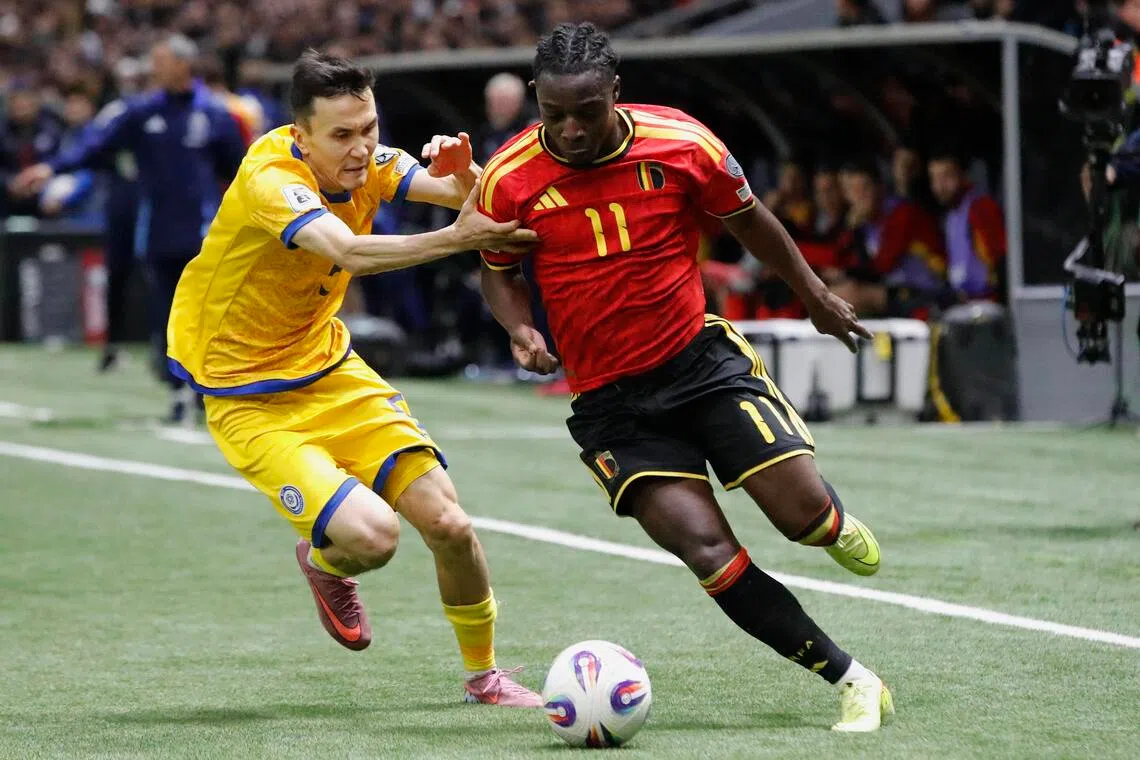 Belgium's Jeremy Doku in action (right) against Kazakhstan's Bagdat Kairov during the match on Nov 15.
