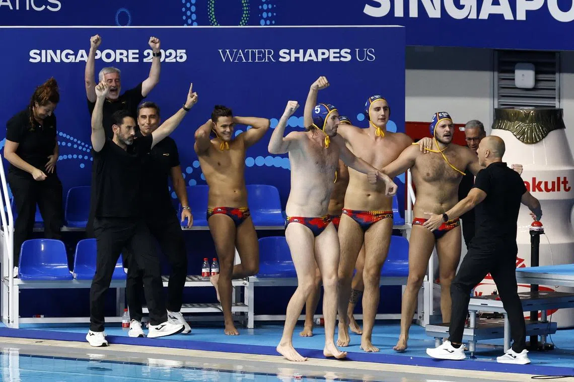 Spain celebrate after winning the World Aquatics Championships men's water polo semi-final against Greece at the OCBC Aquatic Centre on July 22.