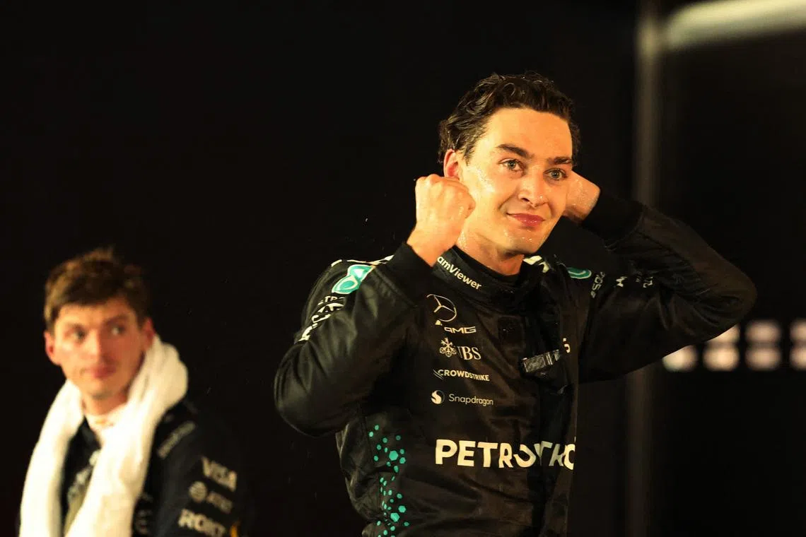 Formula One F1 - Singapore Grand Prix - Marina Bay Street Circuit, Singapore - October 5, 2025 Mercedes' George Russell celebrates after winning the Singapore Grand Prix with second placed Red Bull's Max Verstappen REUTERS/Jeremy Lee/File Photo