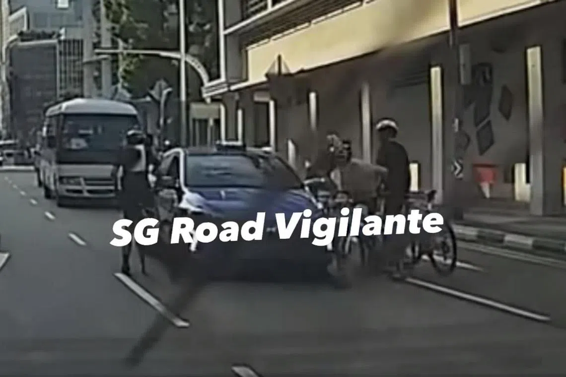 A video uploaded online showed the cyclists surrounding a taxi after the taxi stopped abruptly.