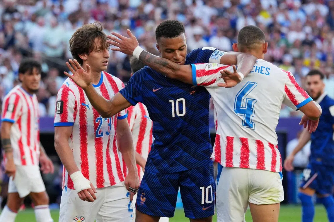 Soccer Football - FIFA World Cup 2026 - Round of 16 - Paraguay v France - Philadelphia Stadium, Philadelphia, Pennsylvania, U.S. - July 4, 2026 France's Kylian Mbappe reacts with Paraguay's Juan Jose Caceres IMAGN IMAGES via Reuters/James Lang