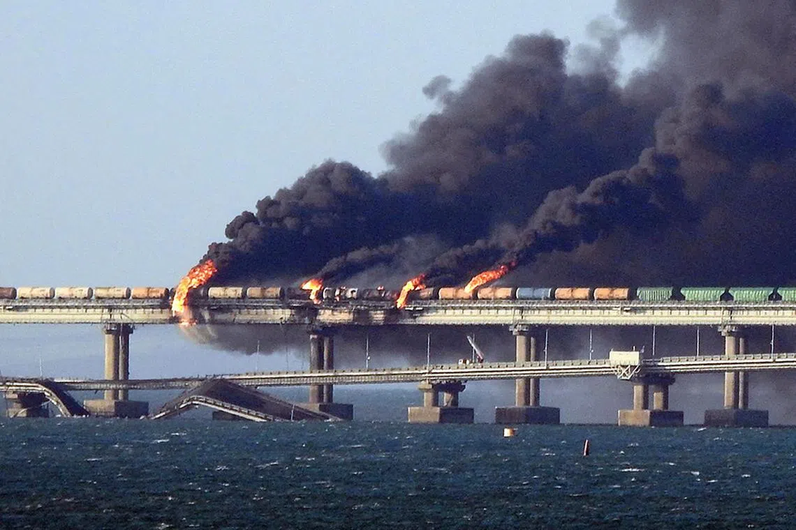 Black smoke billows from a fire on the Kerch bridge that links Crimea to Russia, in October 2022.