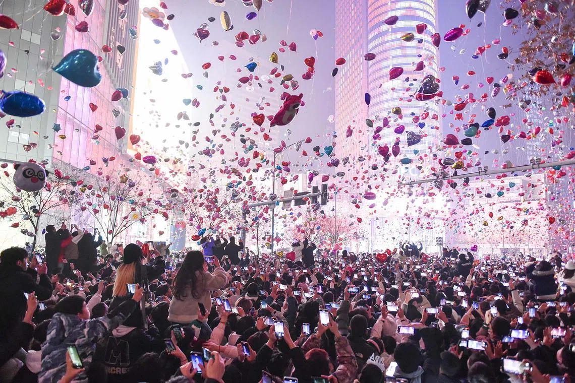 People release balloons during a New Year celebration in Nanjing, in eastern China's Jiangsu province on Jan 1, 2024. 
