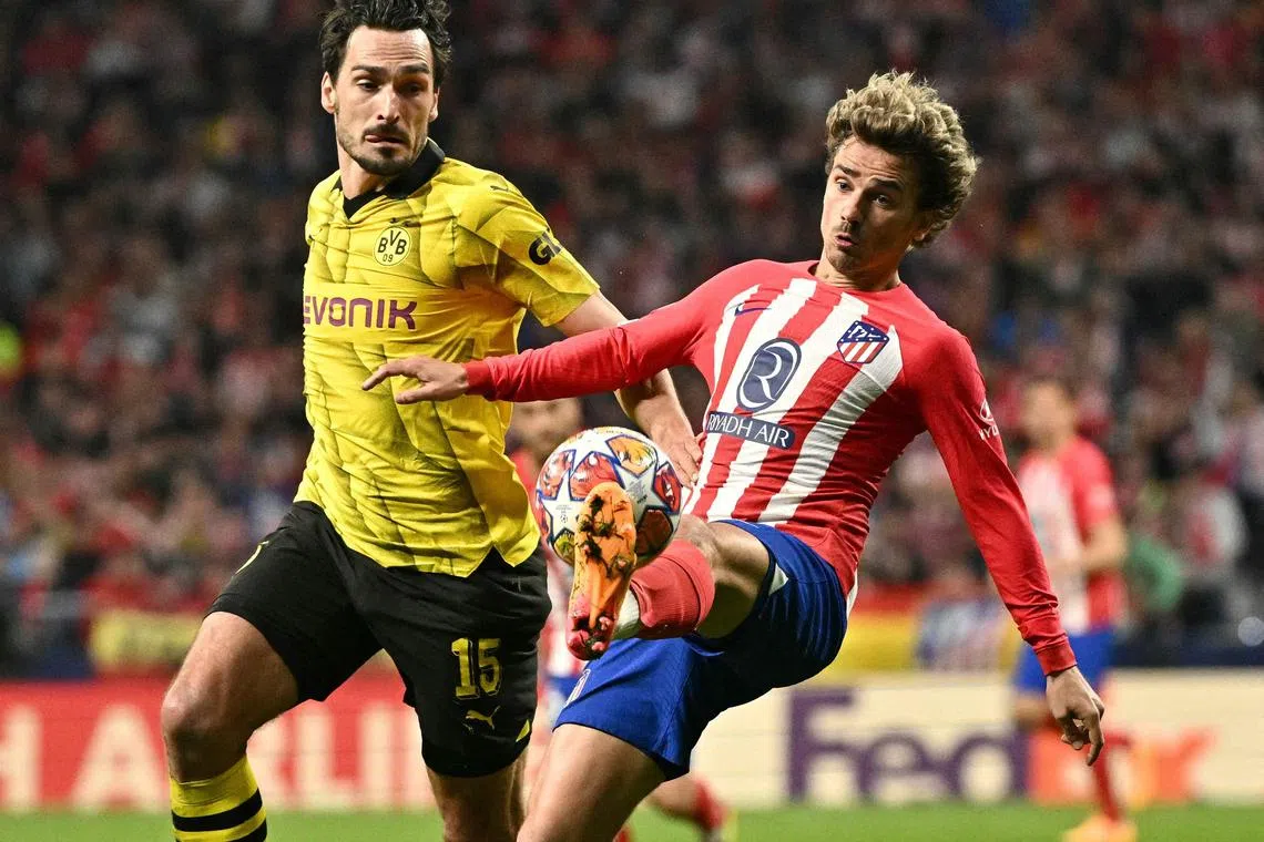 Atletico Madrid forward Antoine Griezmann (right) vies with Dortmund defender Mats Hummels as his team won 2-1 in the Champions League quarter-final, first leg.