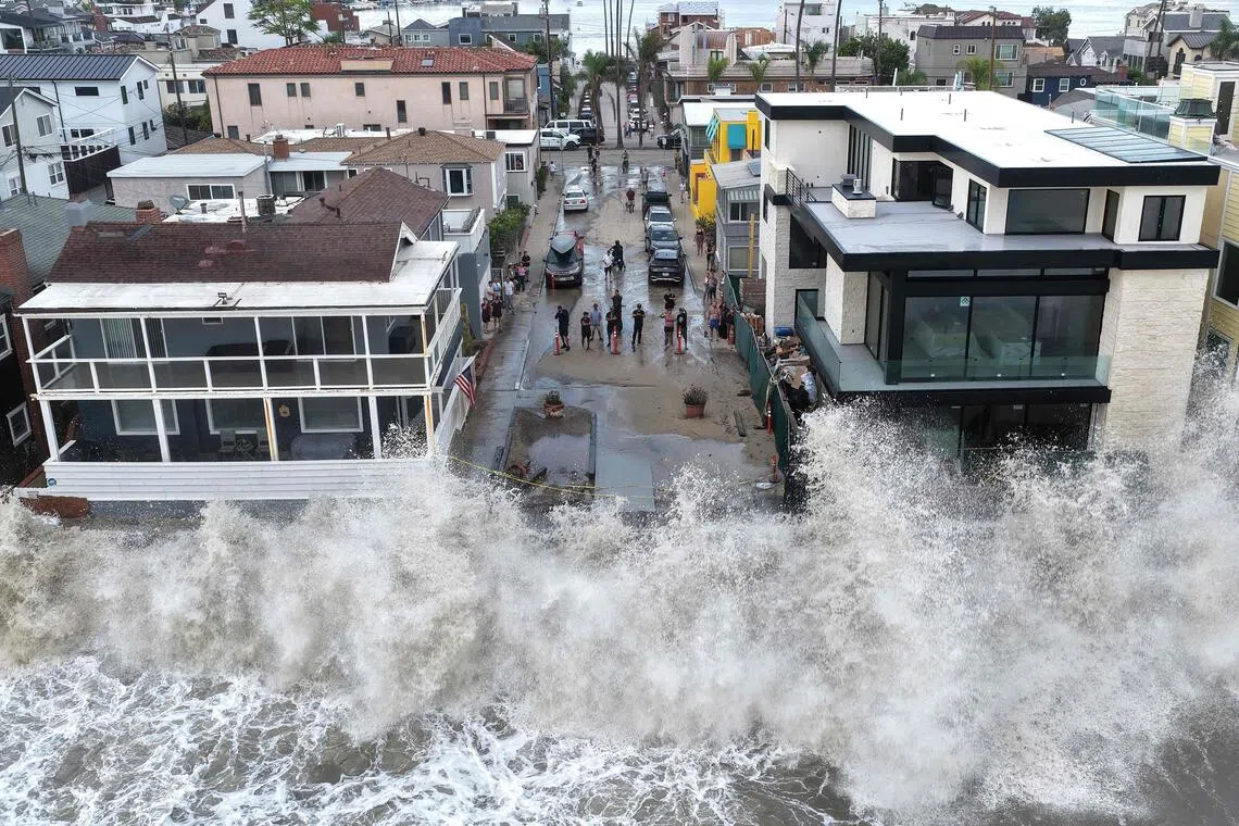 LONG BEACH, CALIFORNIA - SEPTEMBER 07: In an aerial view, a Pacific Ocean wave crashes into a seawall protecting beachside homes on September 7, 2026 in Long Beach, California. Heavy surf generated by offshore Hurricane Marie, amid a record-breaking ocean heat and an emerging El Niño, caused minor coastal flooding and forced the evacuation of roughly 20 beachfront homes along the Long Beach Peninsula.   Mario Tama/Getty Images/AFP (Photo by MARIO TAMA / GETTY IMAGES NORTH AMERICA / Getty Images via AFP)