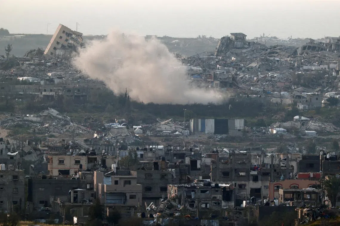 Smoke rises following an explosion in North Gaza, as seen from the Israeli side of the Israel-Gaza border, March 25, 2025. REUTERS/Amir Cohen