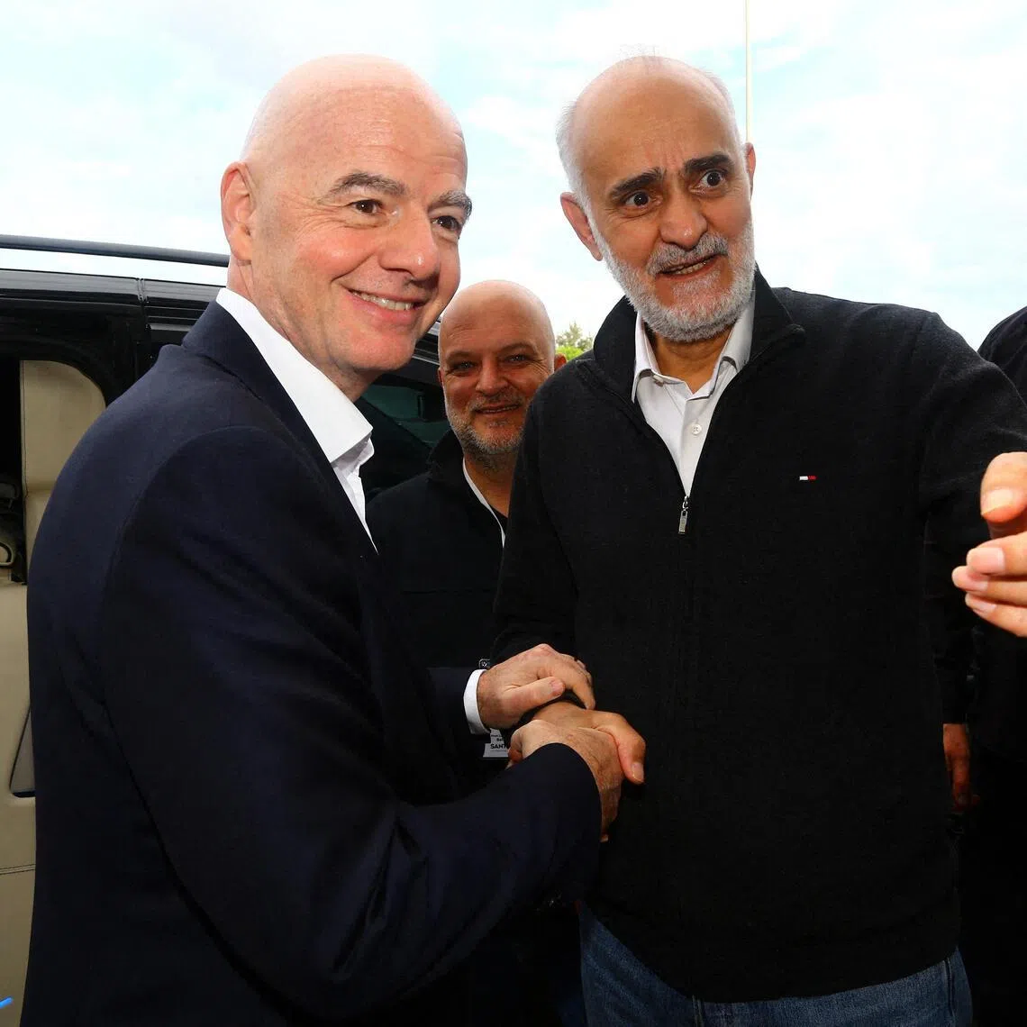 The first vice-president of the Iran football federation Mehdi Mohammad Nabi (right) greeting Fifa president Gianni Infantino before Iran's friendly with Costa Rica in Antalya, Turkey, on March 31, 2026.