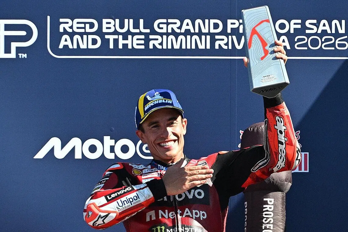 MotoGP - San Marino Grand Prix - Misano World Circuit Marco Simoncelli, Misano, Italy - September 13, 2026
Ducati Lenovo Team's Marc Marquez celebrates with a trophy on the podium after winning the MotoGP race REUTERS/Jennifer Lorenzini