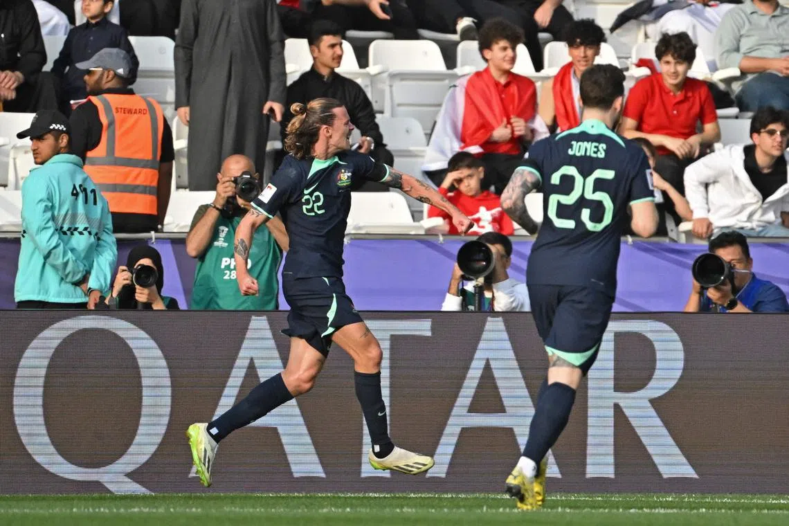 Australia midfielder Jackson Irvine celebrates after scoring in the Asian Cup match against Syria.