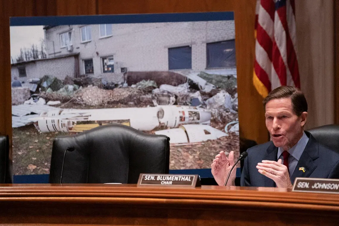 US Senator Richard Blumenthal speaks in front of a poster depicting a Russian cruise missile during a Homeland Security and Governmental Affairs Subcommittee on Investigations hearing on the use of US microchips in Russian weapons systems.