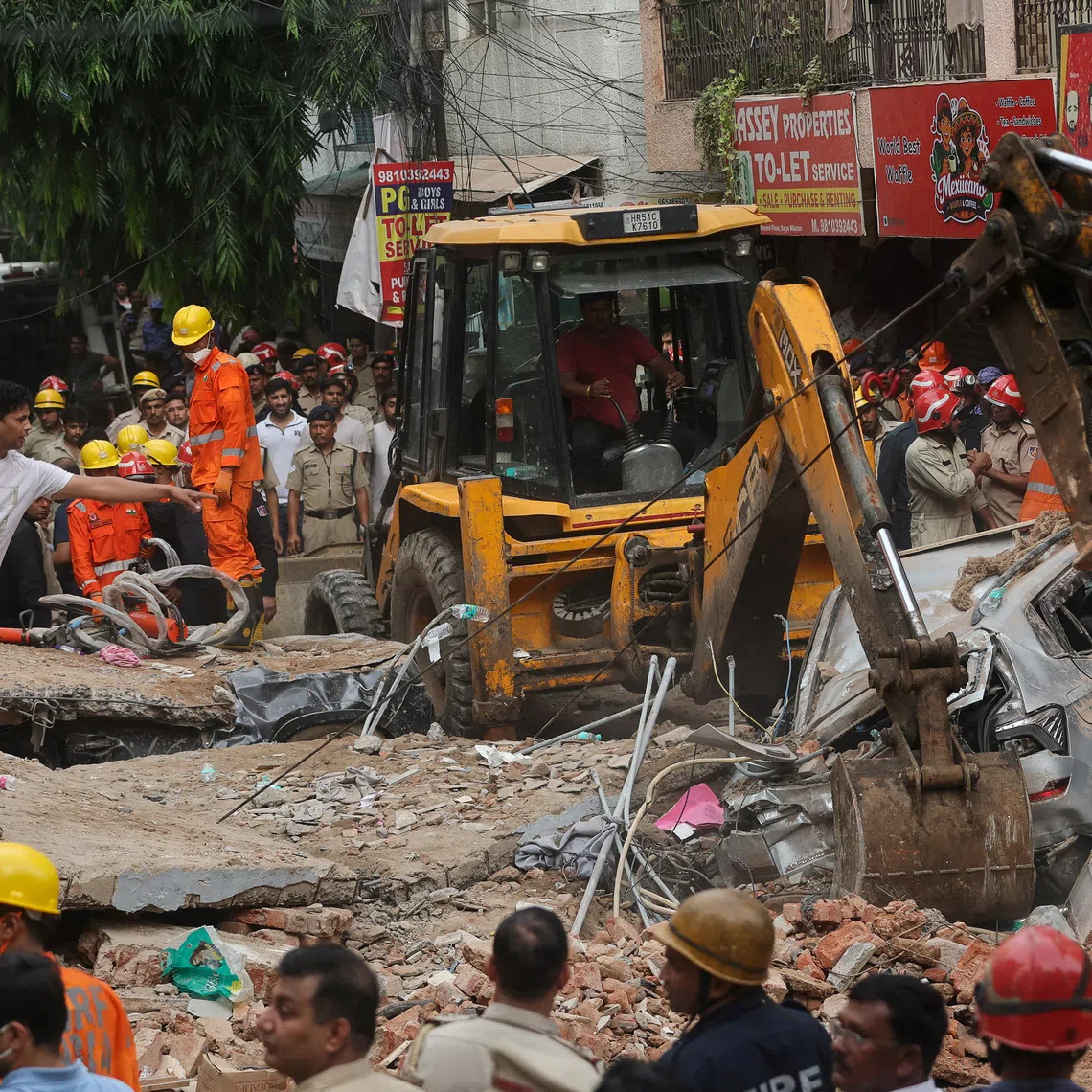 Emergency personnel inspect the site and look for survivors after a building collapsed, in New Delhi, India, September 6, 2026. REUTERS/Francis Mascarenhas     TPX IMAGES OF THE DAY