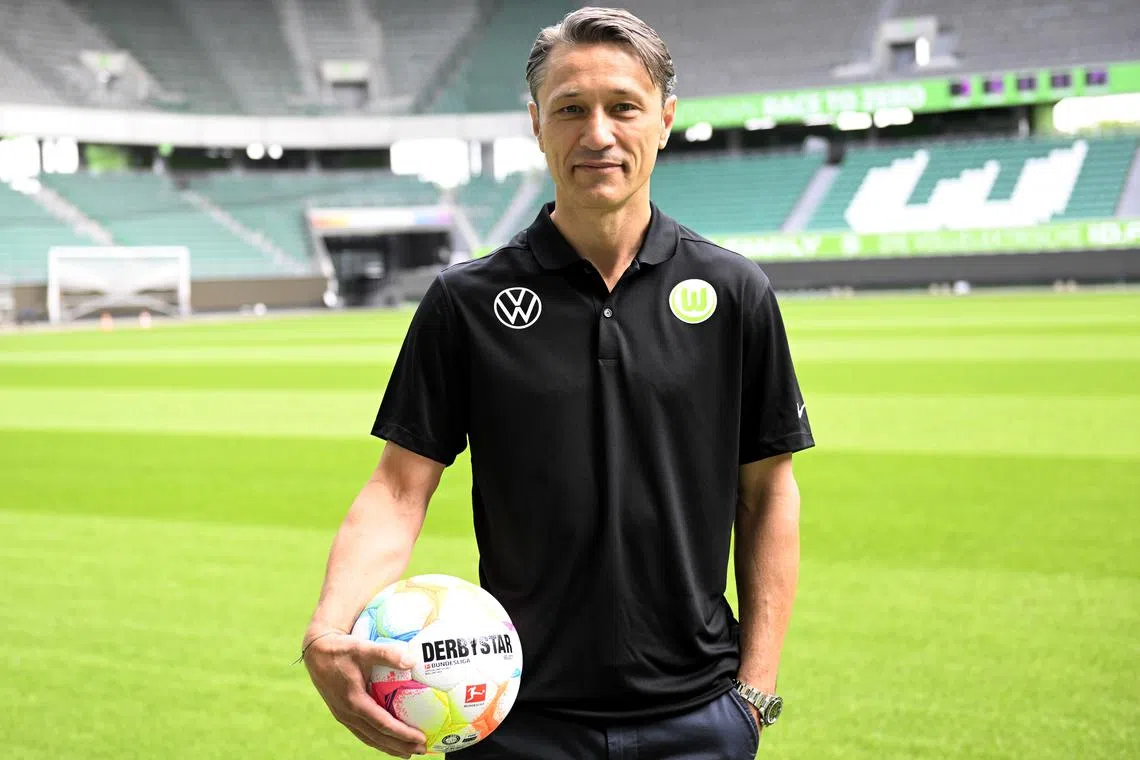 FILE PHOTO: Soccer Football - VFL Wolfsburg unveil new coach Nico Kovac - Volkswagen Arena, Wolfsburg, Germany - June 20, 2022 New VFL Wolfsburg coach Nico Kovac poses for a photograph on the pitch after the unveiling REUTERS/Fabian Bimmer/File Photo