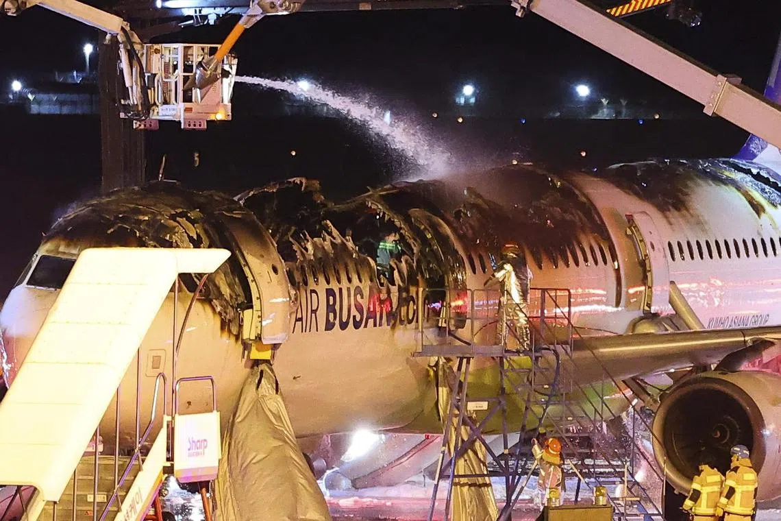 epa11859616 Firefighters work to extinguish a fire on an Air Busan airplane at Gimhae International Airport in Busan, South Korea, 28 January 2025 (issued 29 January 2025). On 28 January the plane, bound for Hong Kong, caught fire during take off procedures at Gimhae International Airport in Busan, prompting all its passengers and crew members to evacuate.  EPA-EFE/YONHAP/ HYUNG-JOO SON SOUTH KOREA/OUTSOUTH KOREA OUT