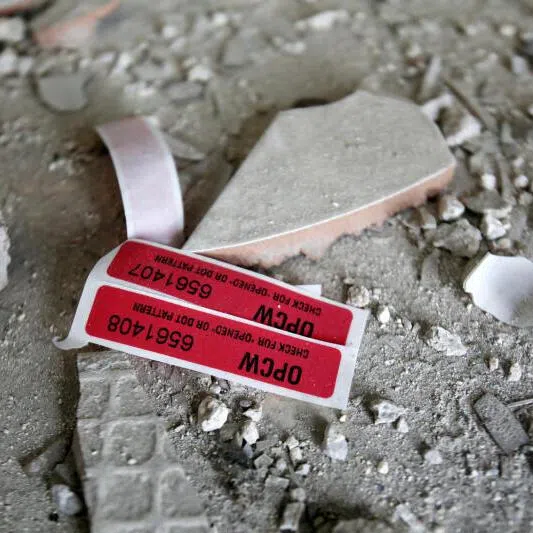 Labels of the Organisation for the Prohibition of Chemical Weapons (OPCW) are seen iside a damaged house in Douma in Damascus, Syria.